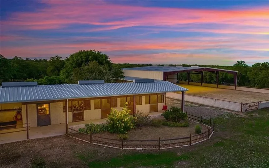 Kenshō Stables arena and barn at sunset, Wimberley Texas