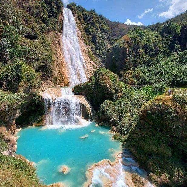 The turquoise cascades of El Chiflón waterfall surrounded by jungle