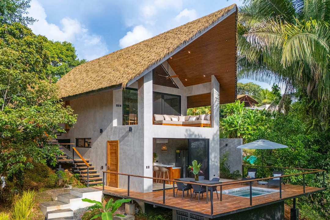 Modern jungle villa with thatched roof and private deck at Mandala Ojochal, Costa Rica