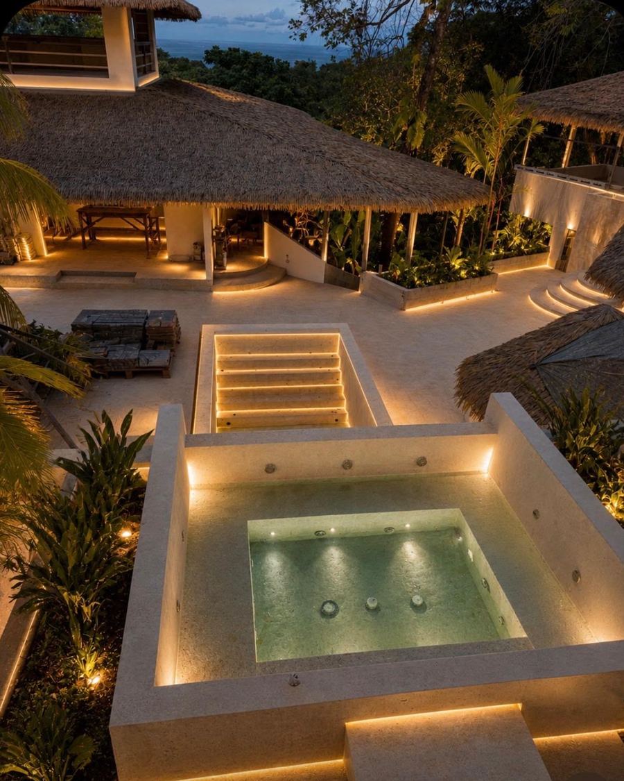 Lit pool terrace at dusk